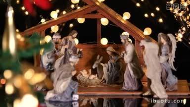 耶稣基督诞生的场景与气氛灯附近的圣诞树圣诞场景